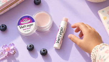 Dirty Good Berry Blast Kids Lip Balm tin and Berry Blast chapstick side by side, the two formats in the Berry Me & Mini I Kids Lip Combo