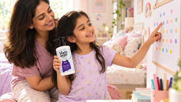 Girl holding Dirty Good Tangle Free Conditioning Shampoo next to a sticker calendar with her mother