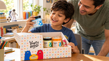 Boy opening The Essentials — 4-Piece Gift Set · Boys from Dirty Good at his desk with his father