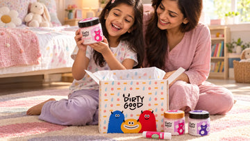 Girl opening The Essentials — 4-Piece Gift Set · Girls from Dirty Good with her mother