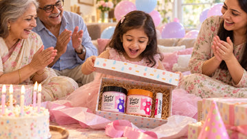 Five-year-old girl opening The Little Treat — 3-Piece Gift Set · Girls from Dirty Good at her birthday