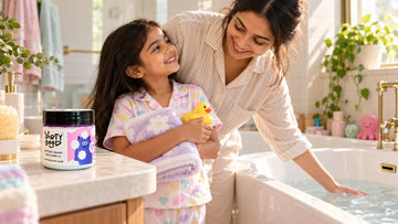 Mother and daughter getting ready for bath time, with a jar of Dirty Good Cotton Candy Kids Body Wash on the bathroom counter